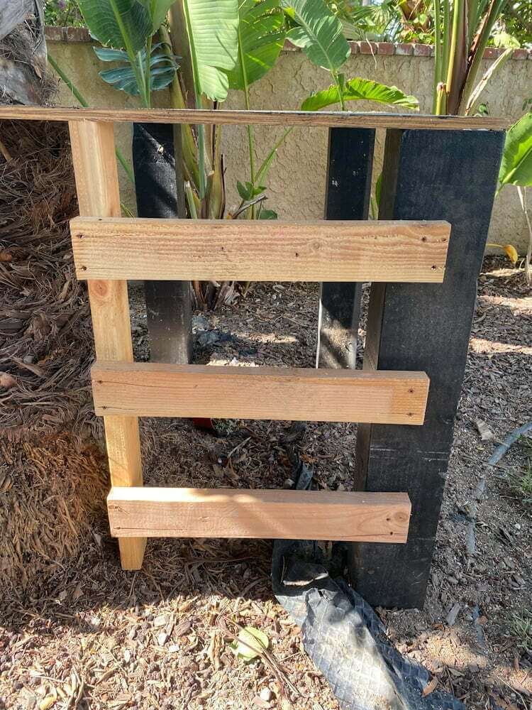 closeup of rough wood zipline platform ladder