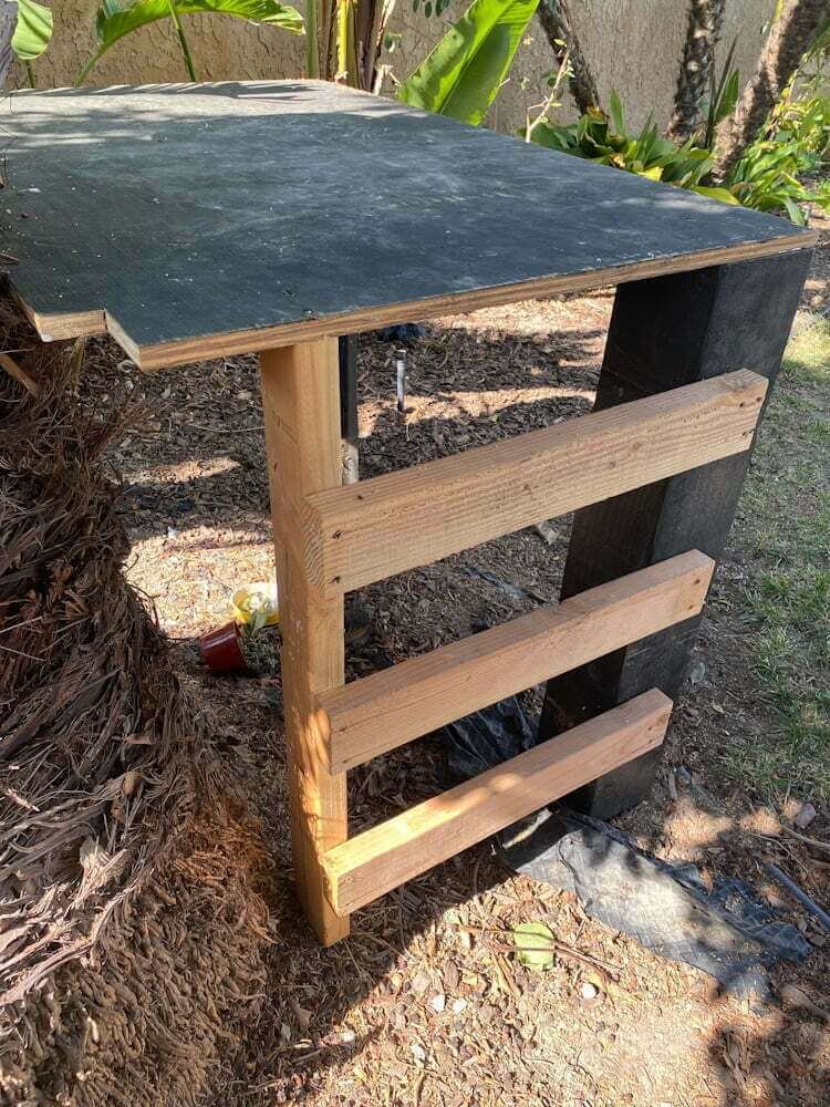 wood zipline platform with ladder, angled view