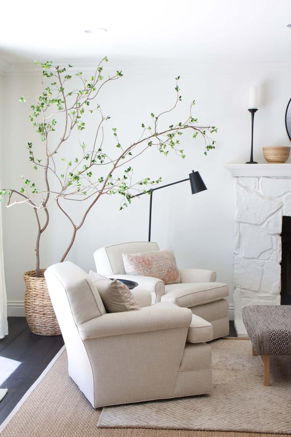 Large faux tree showing how to make a fake tree in pot, basket in corner of living room