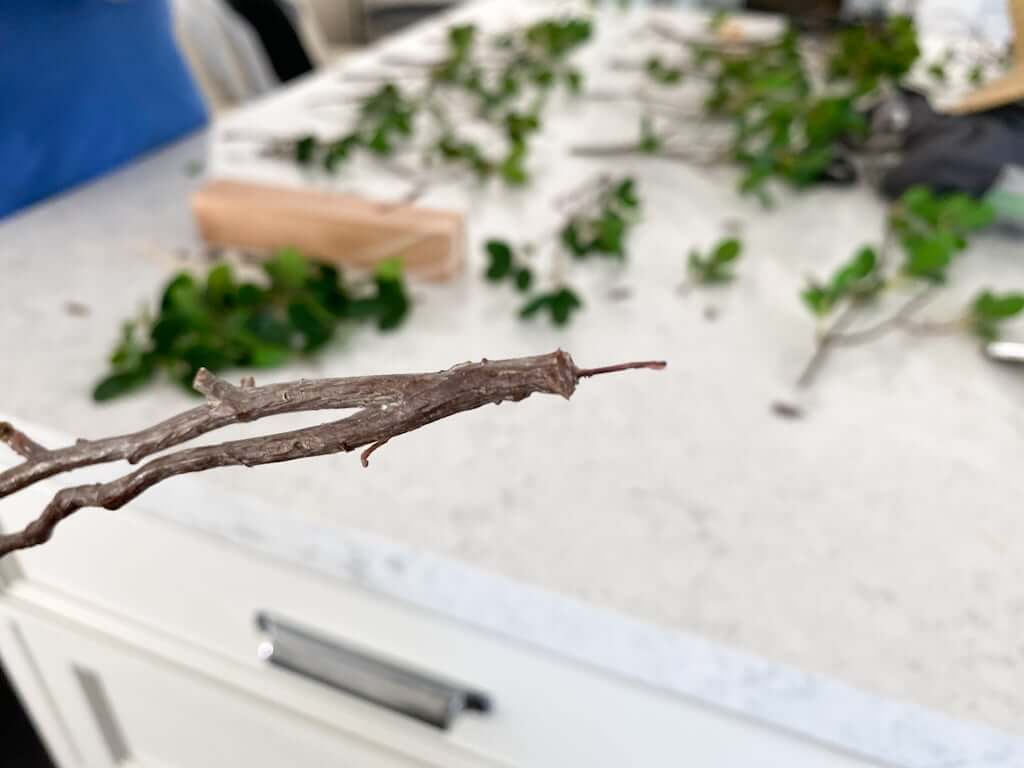 wire exposed on DIY artificial tree branches and leaves