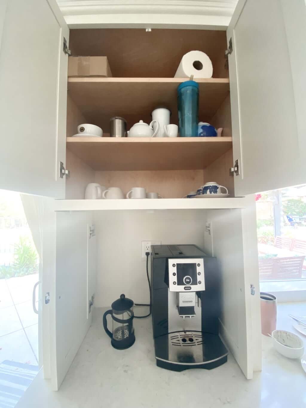 kitchen with appliance garage for coffee station and shelves above