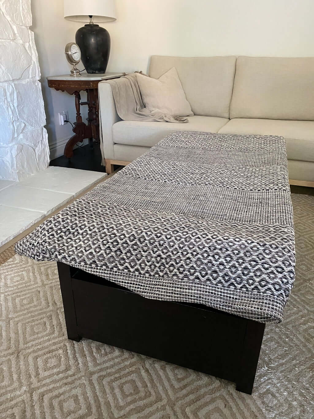 rug laid on ottoman coffee table for testing