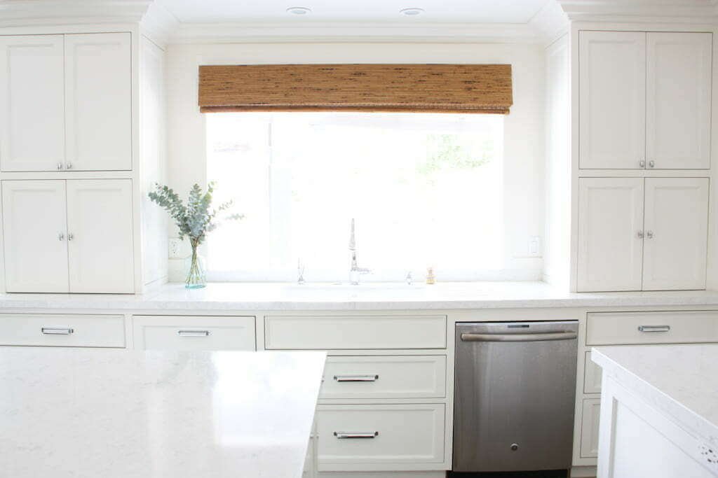 White kitchen with drawers under kitchen sink for under sink storage