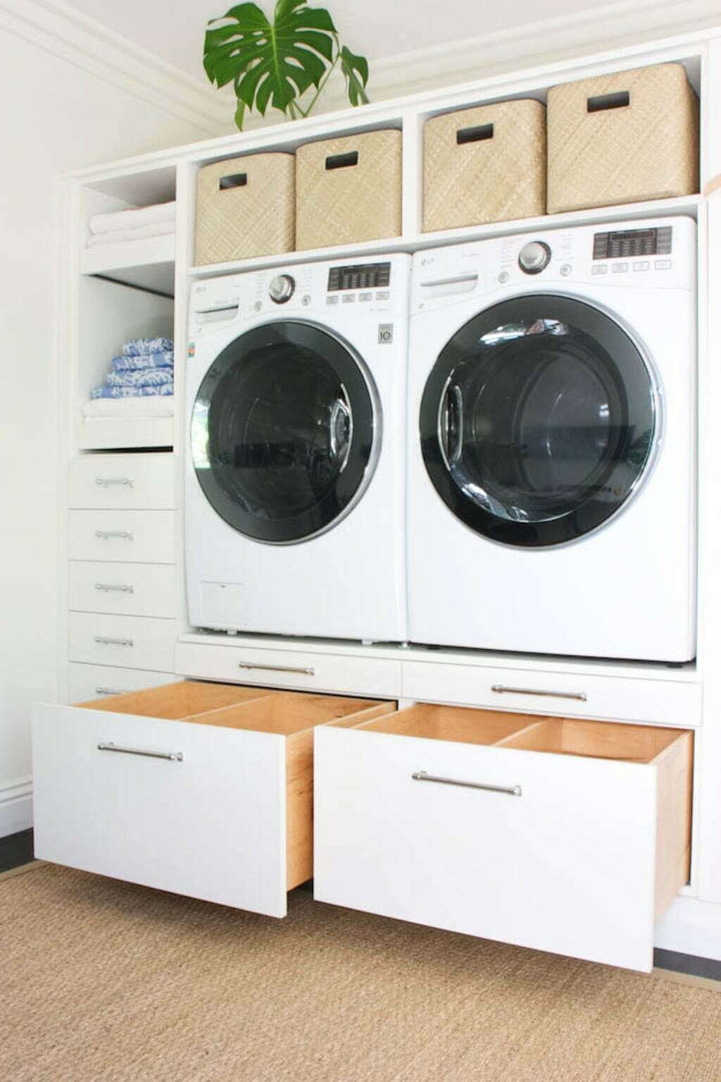 laundry room makeover with two large storage drawers under washer and dryer