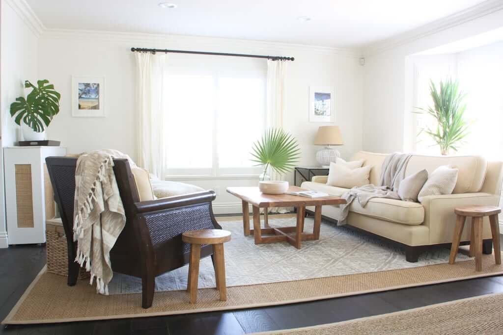 neutral living room with pop up TV cabinet in corner