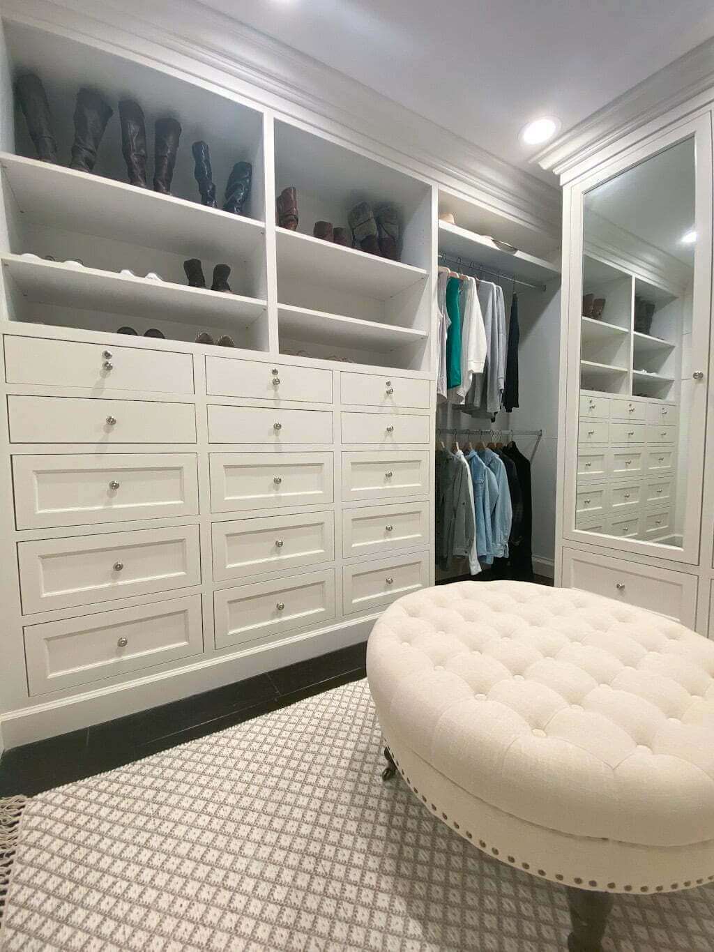white master closet design ideas with ottoman and drawers