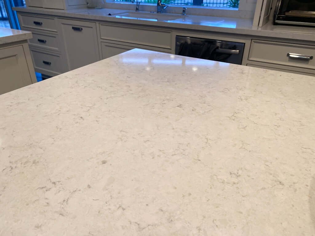 closeup of LG Viatera Cirrus quartz countertops on kitchen island