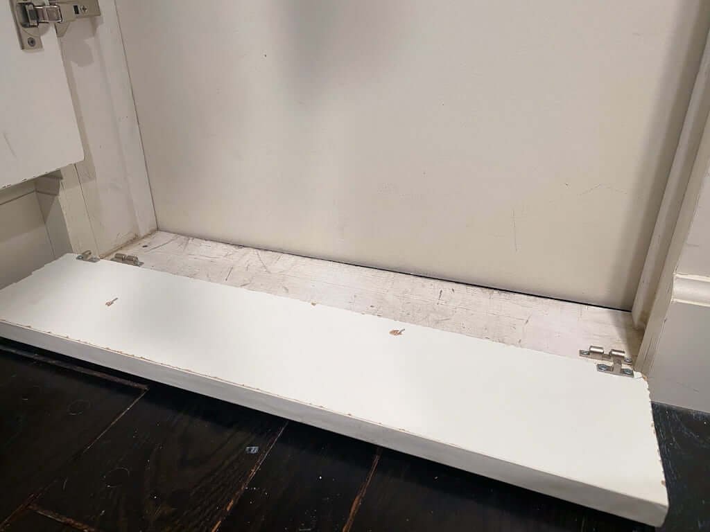 hidden attic access door molding in walk-in closet