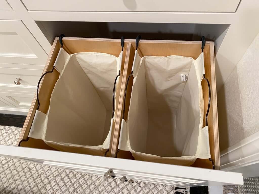 pull out double laundry hamper drawer in closet with two fabric bags, hidden in drawers