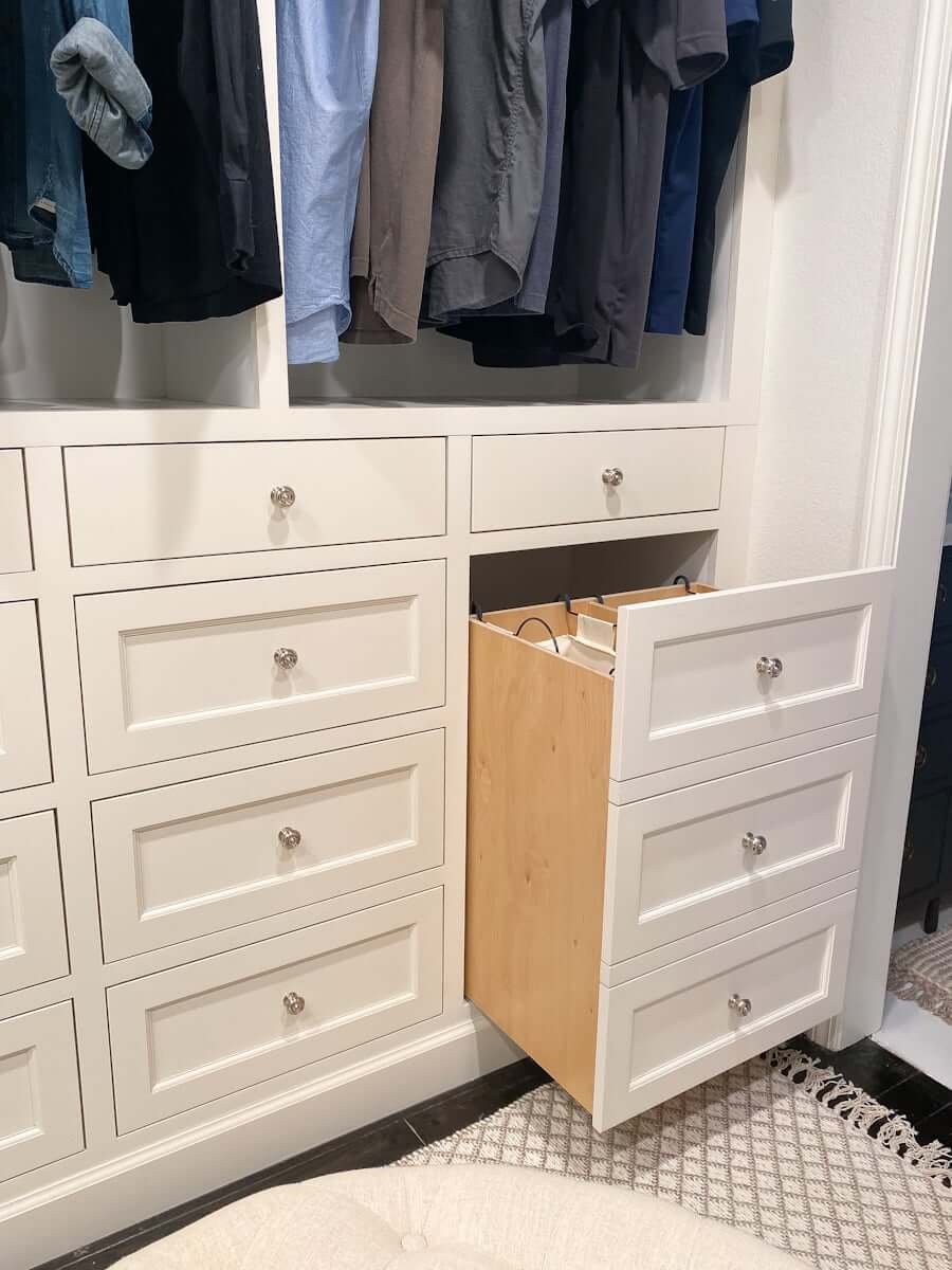 Pull out laundry hamper drawer in closet for sorting, hidden in closet