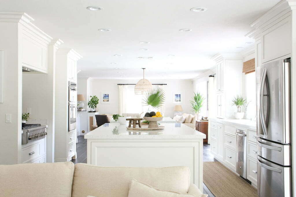 white kitchen with white cabinets and solid white quartz backsplash