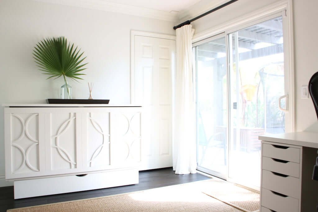 white office guest room with hidden Murphy cabinet bed and white IKEA desk