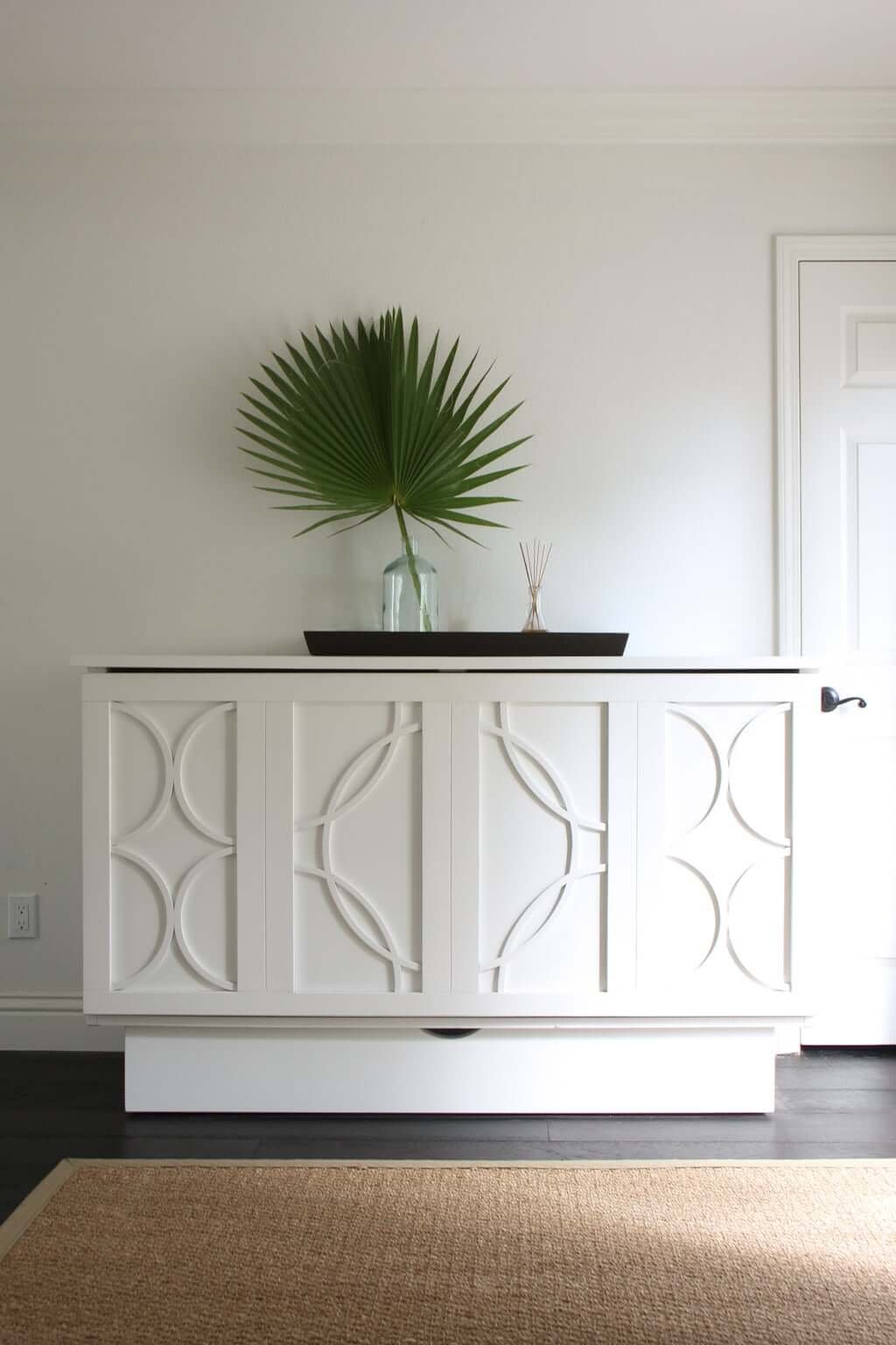 white cabinet bed queen murphy bed in guest room with fan palm on top