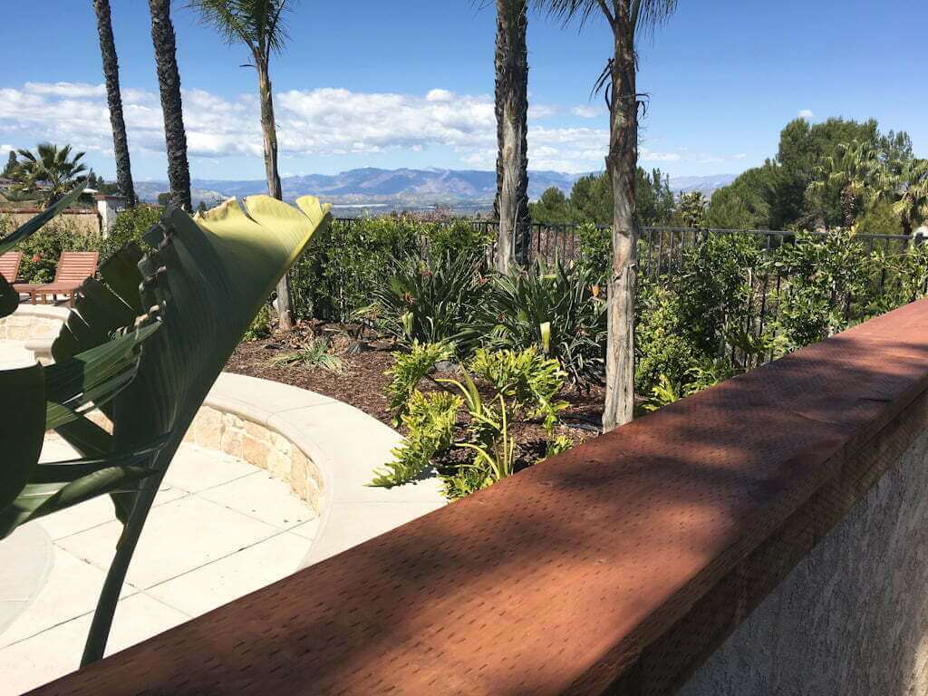 view over temporary wood counter top in outdoor bar, looking to mountain view in distance