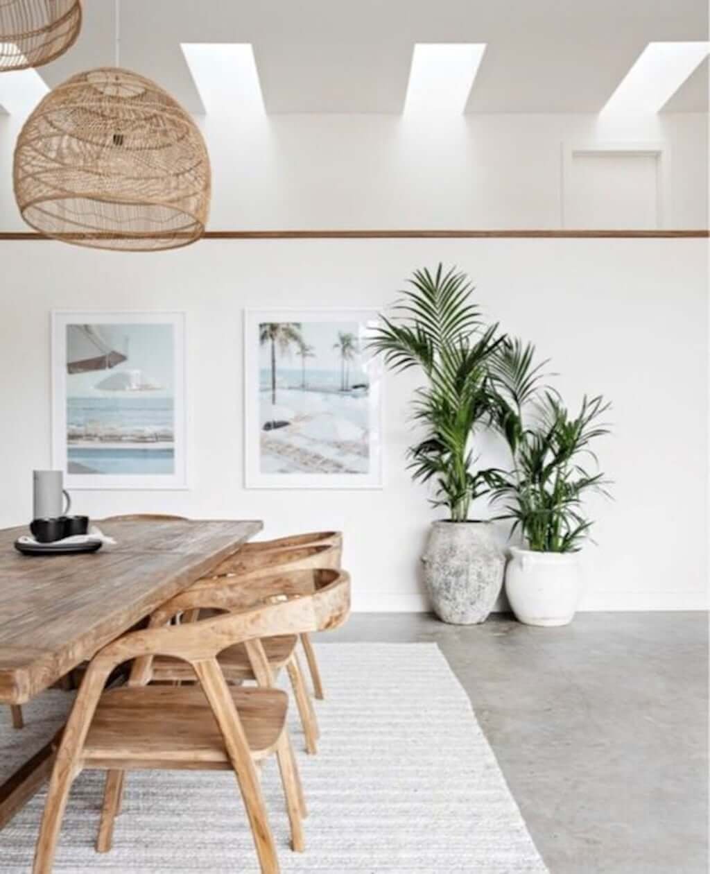 modern beach house interior with wood dining room and concrete floors