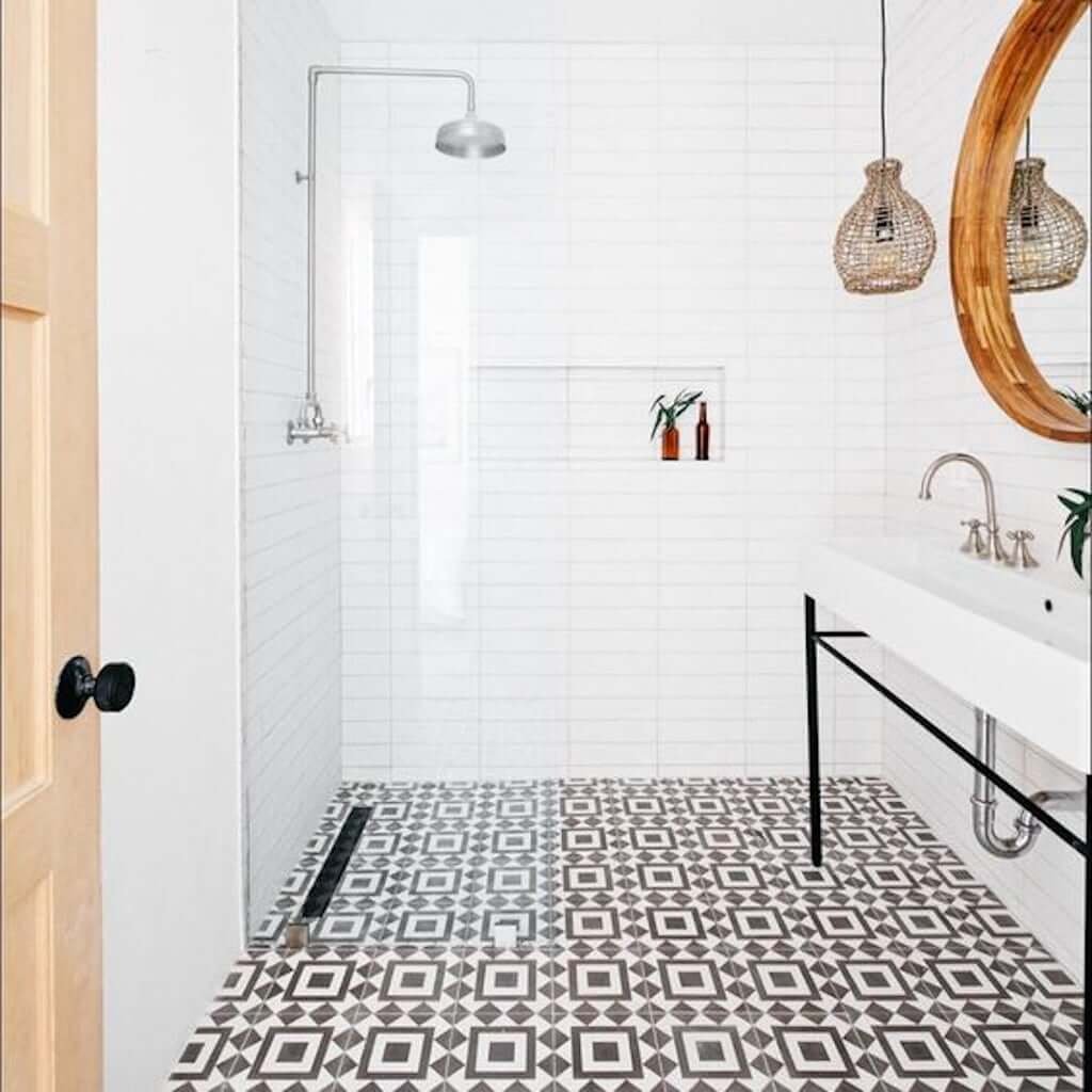 Spanish tile pattern bathroom floor with white shower and white wall tile