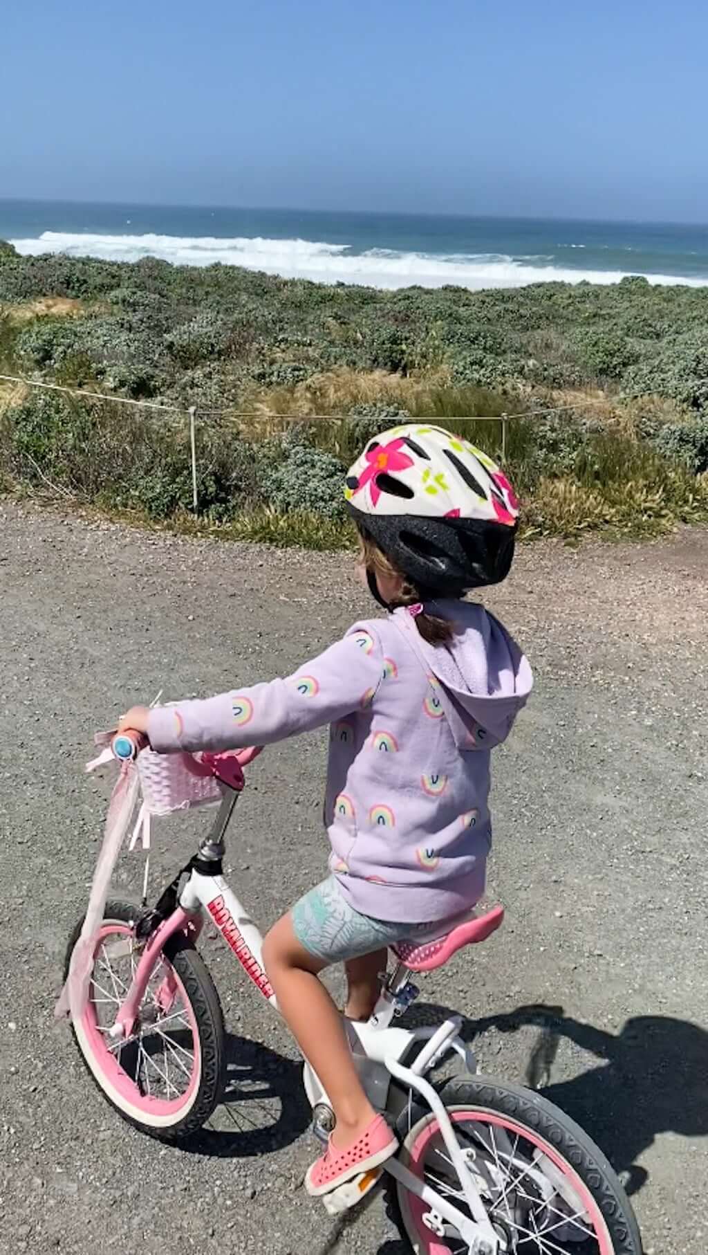 girl biking Montana de Oro trail near Morro Bay