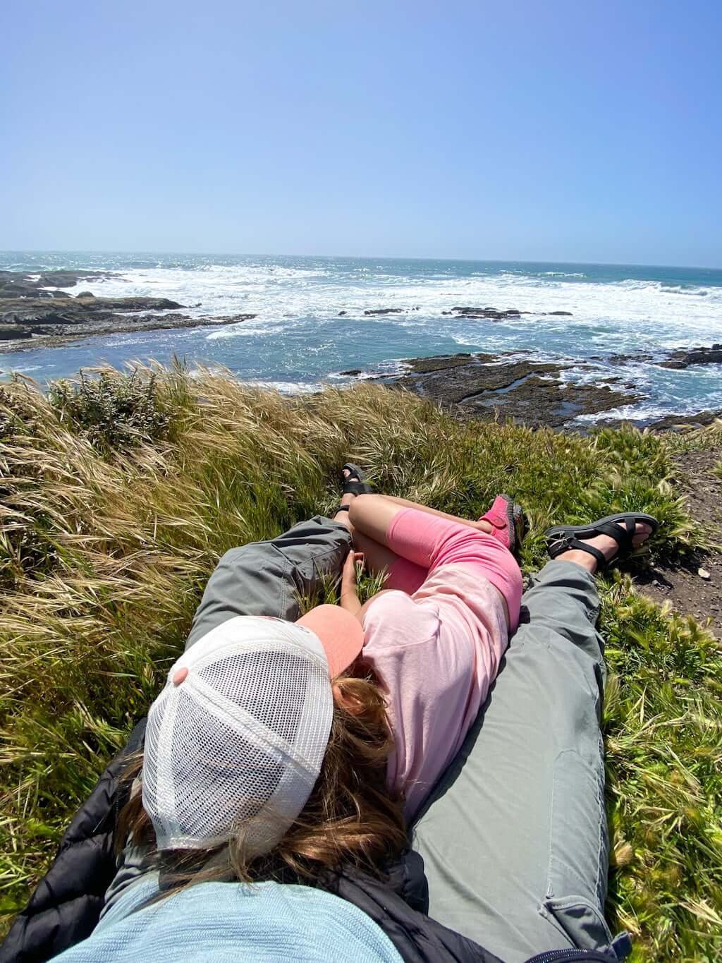 mother and daughter looking out over tidepools near San Luis Obispo and Morro Bay