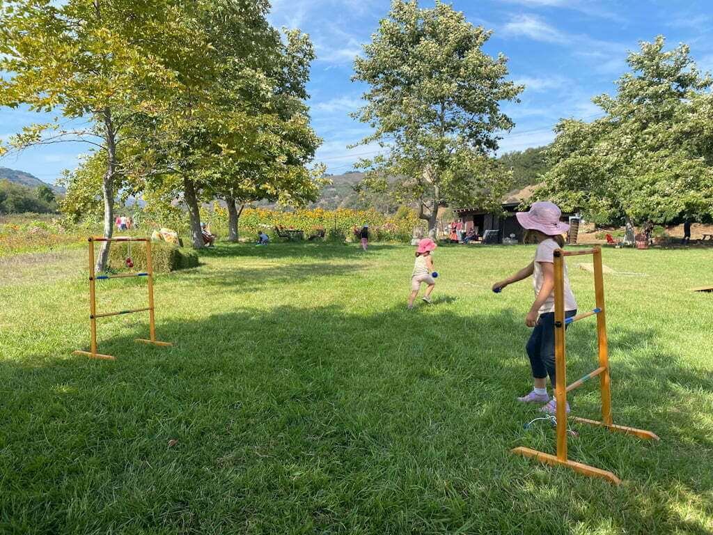 kids playing games on lawn at SLO Creek Farms