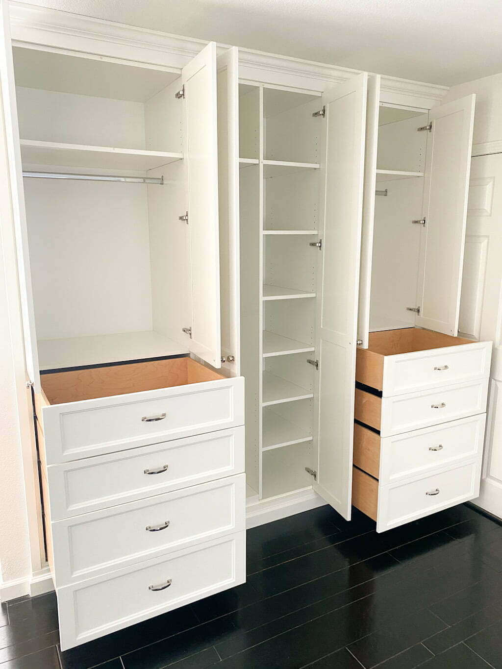 built in dresser in closet, white with silver hardware, and shelves and storage space