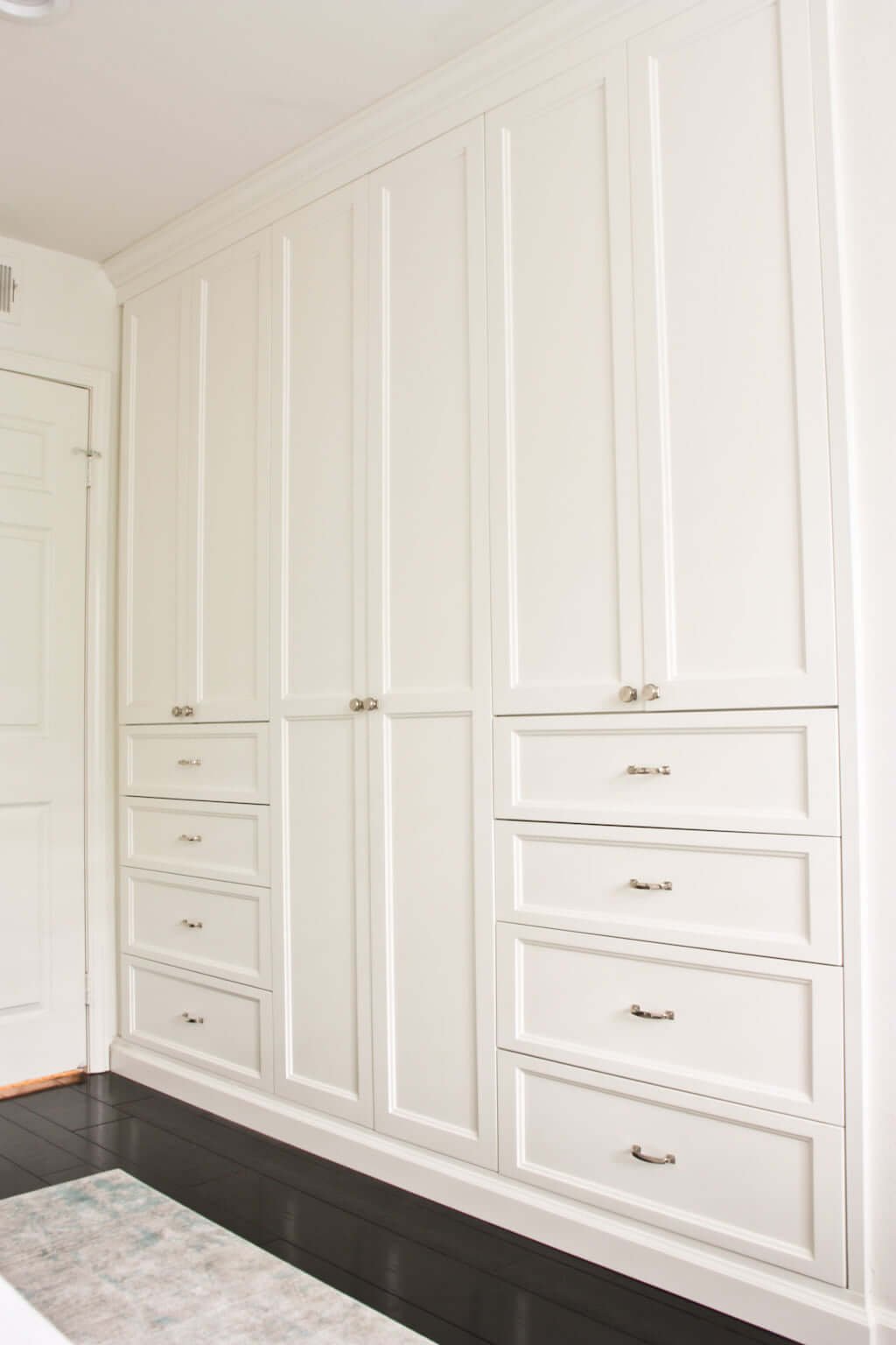 bedroom closet built ins, white wardrobe with polished nickel hardware and drawers with dresser