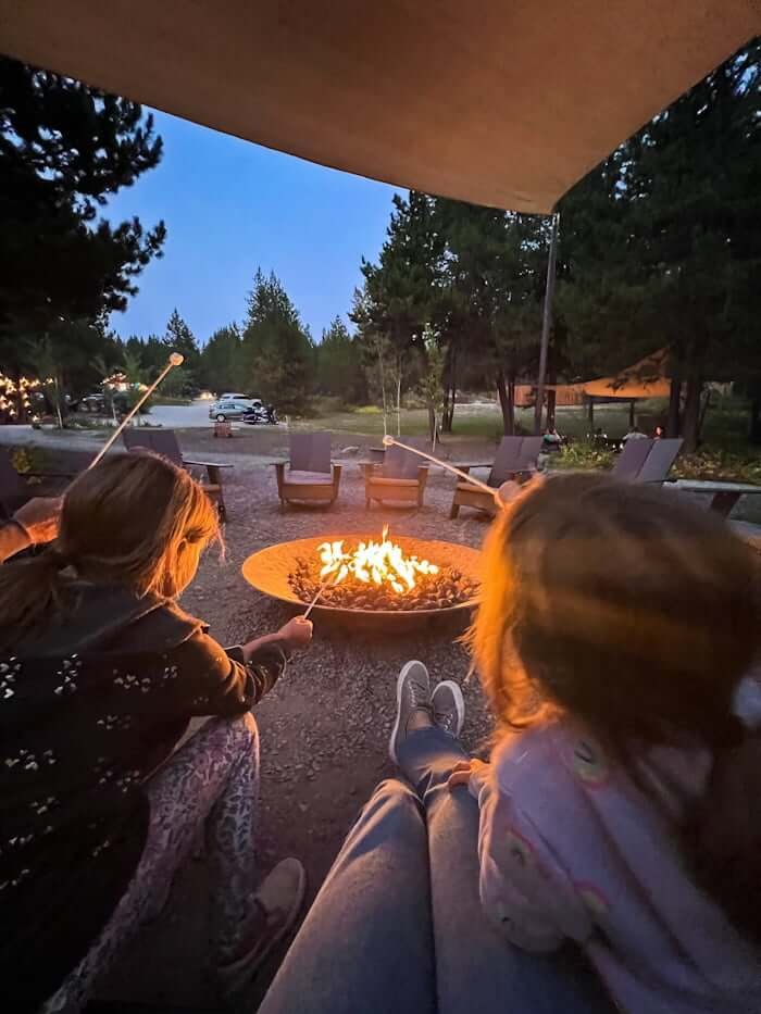 campfire with smores while camping in Glacier National Park