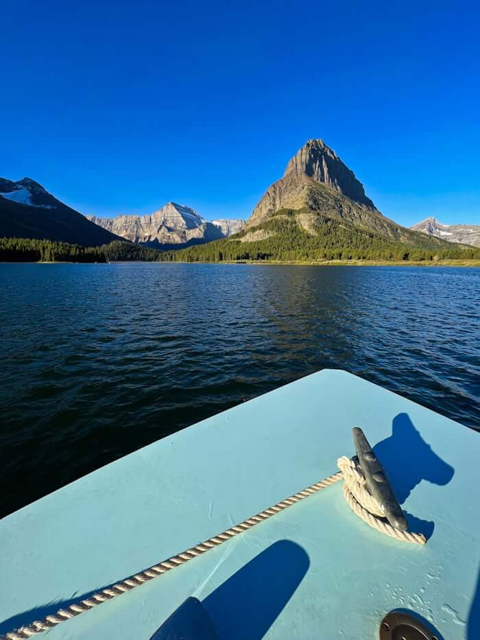 view from boat on Many Glacier hotel boat tour, Glacier National Park in distance
