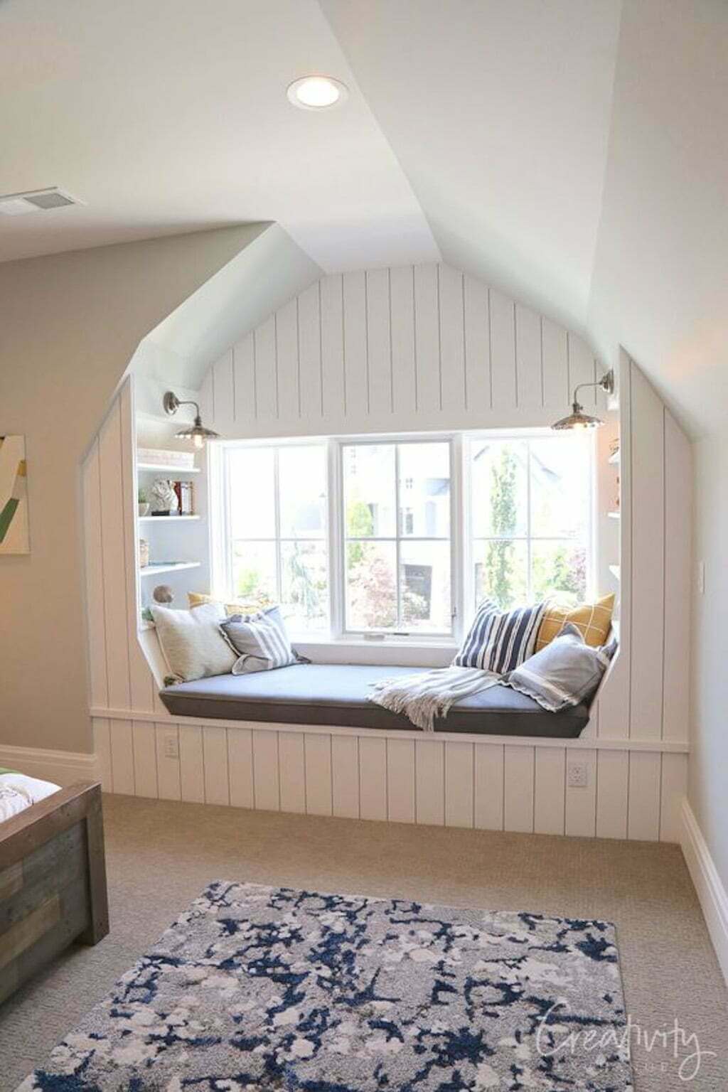 window seat with white plank walls