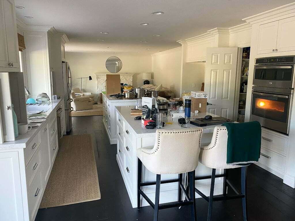 large kitchen with double islands being packed up for a move