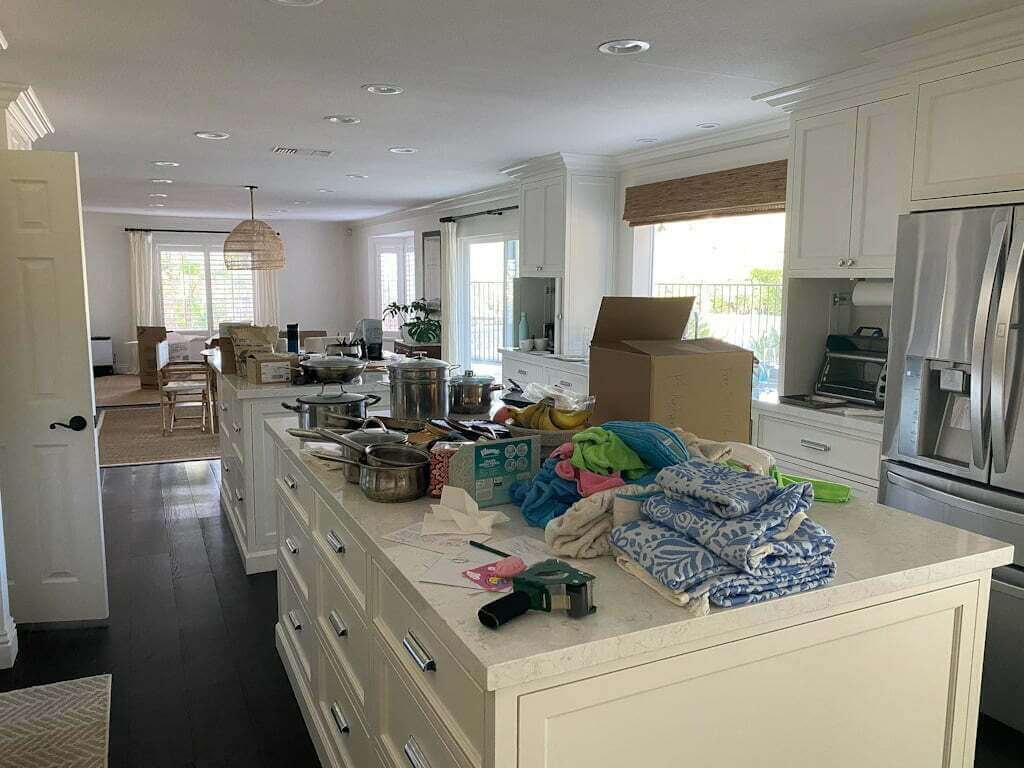 large kitchen with double islands being packed up for a move