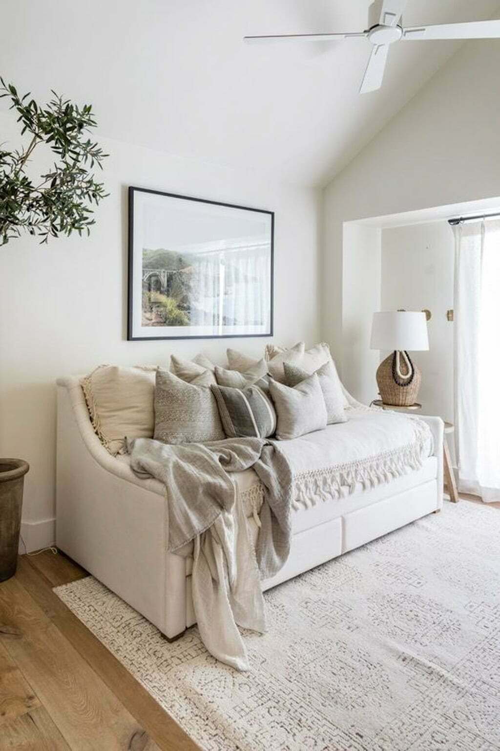 daybed in guest room with pillows and blankets