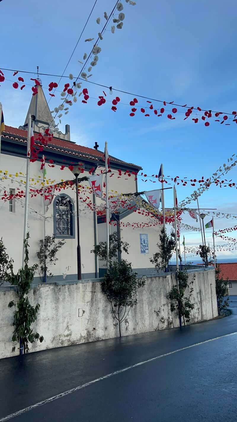 Madeiran festival with church and flags