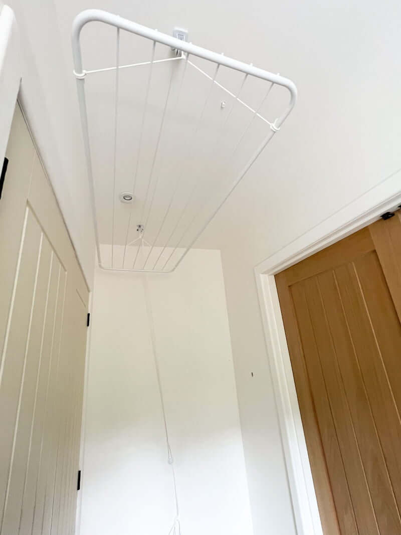 ceiling laundry pulley in up position in small narrow laundry room, space saving idea