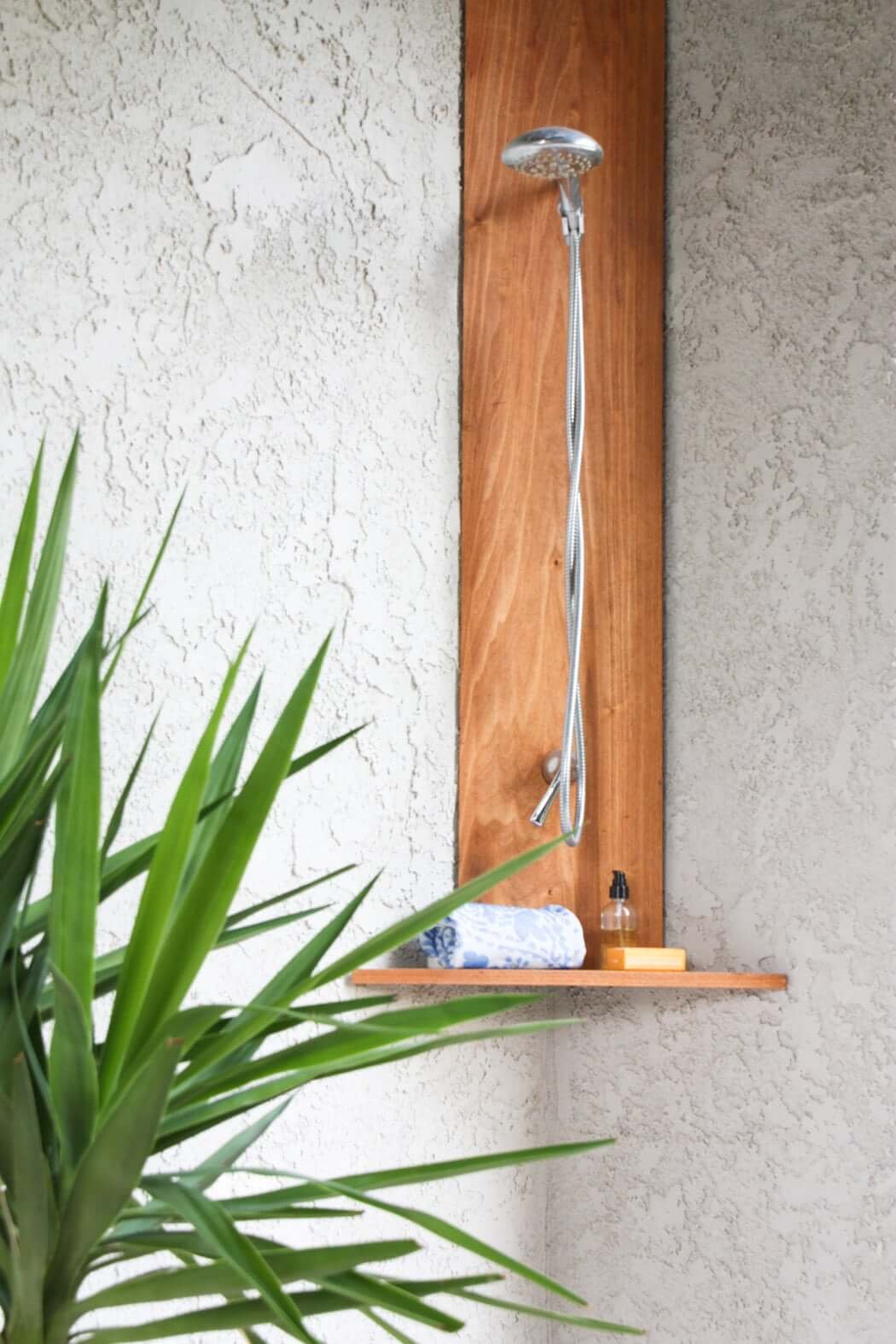 DIY outdoor shower plans with shower head and shelf