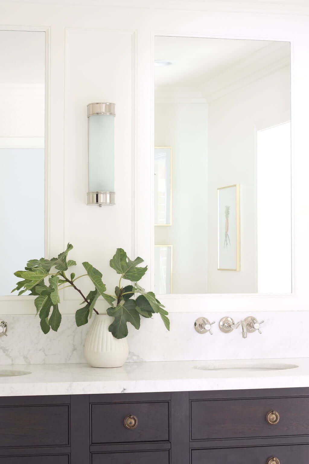 wall faucet height above sink in white bathroom with fig leaves on counter