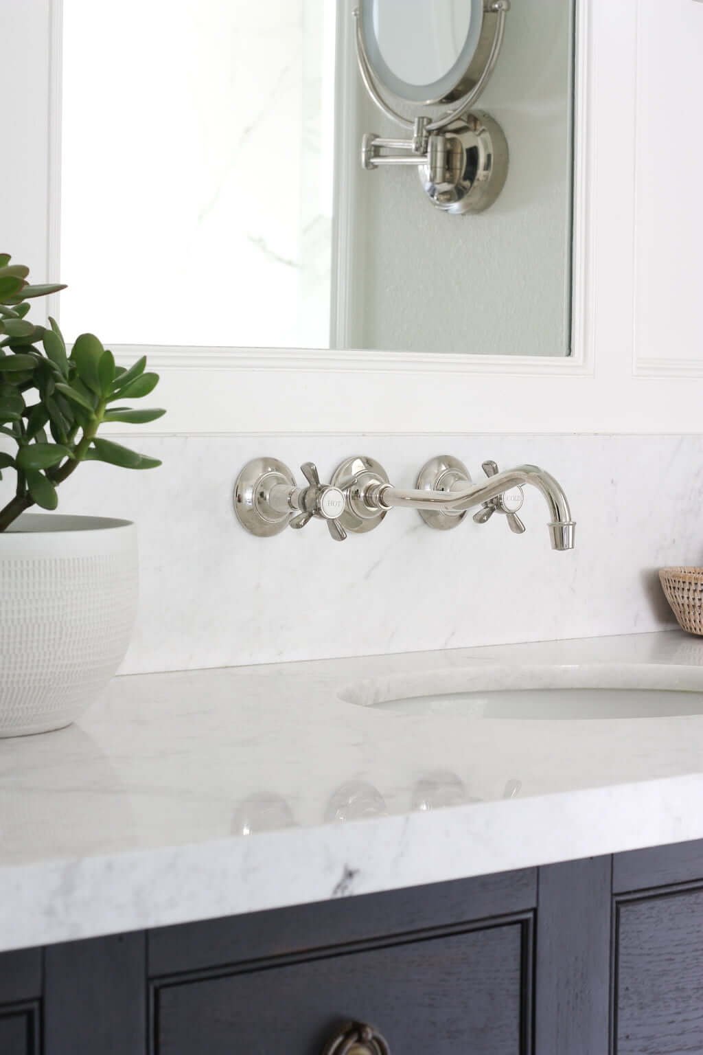 wall faucet height above sink in bathroom with marble counters