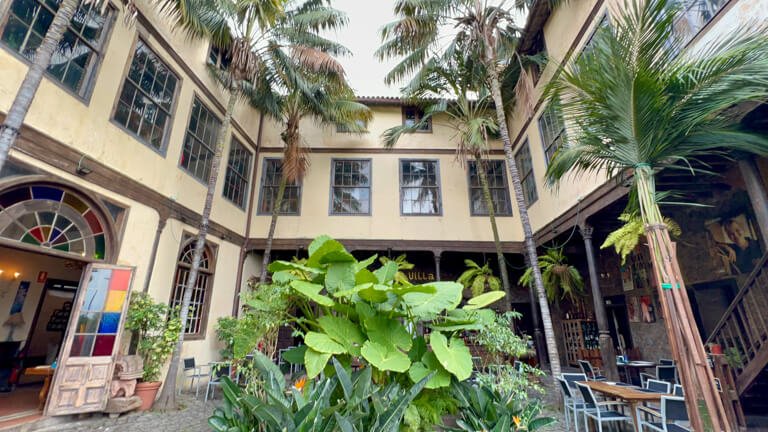 Canary Islands courtyard restaurant with palm trees and plants