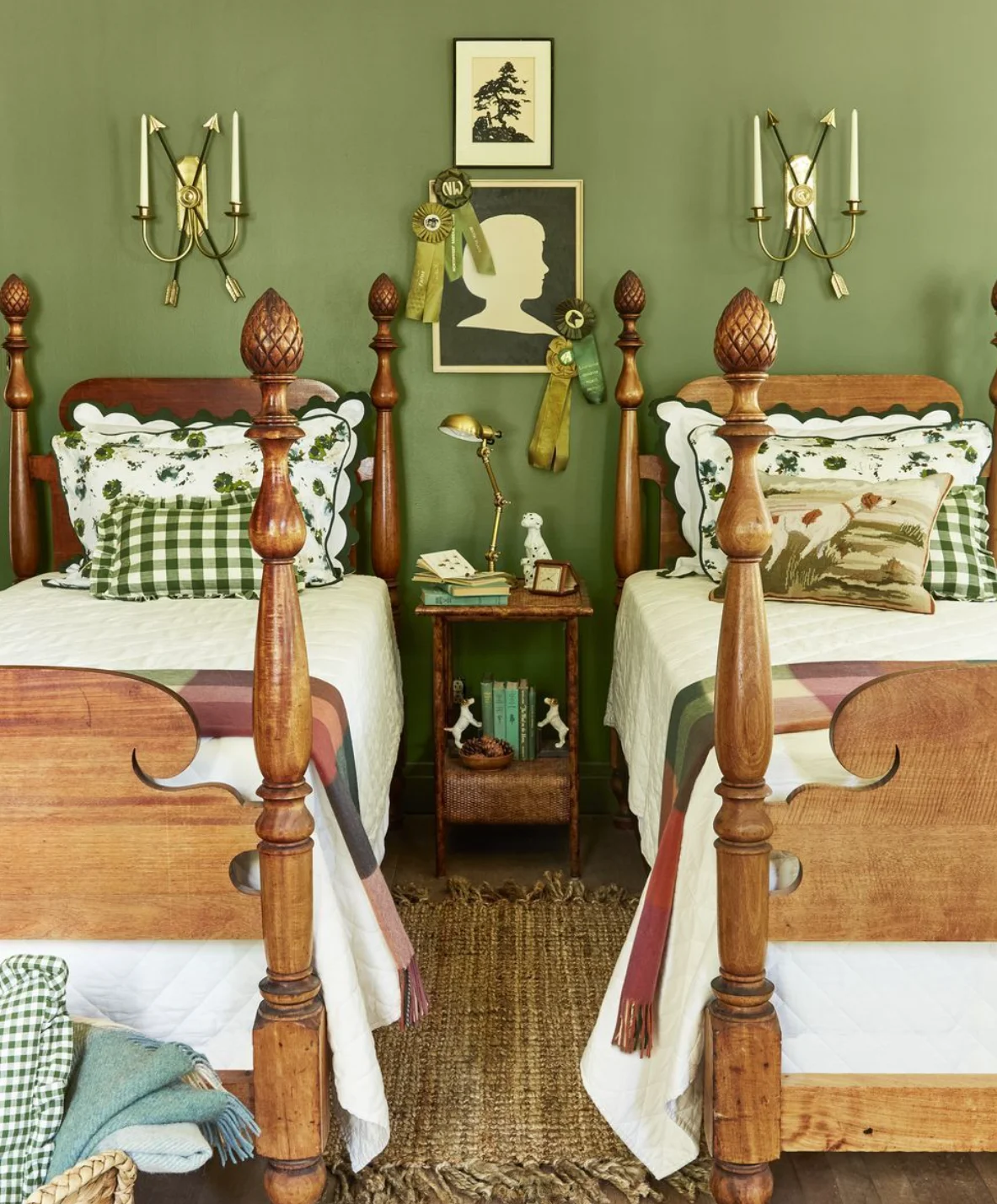 Twin beds with small table in between. Green walls. This is a small guest bedroom idea