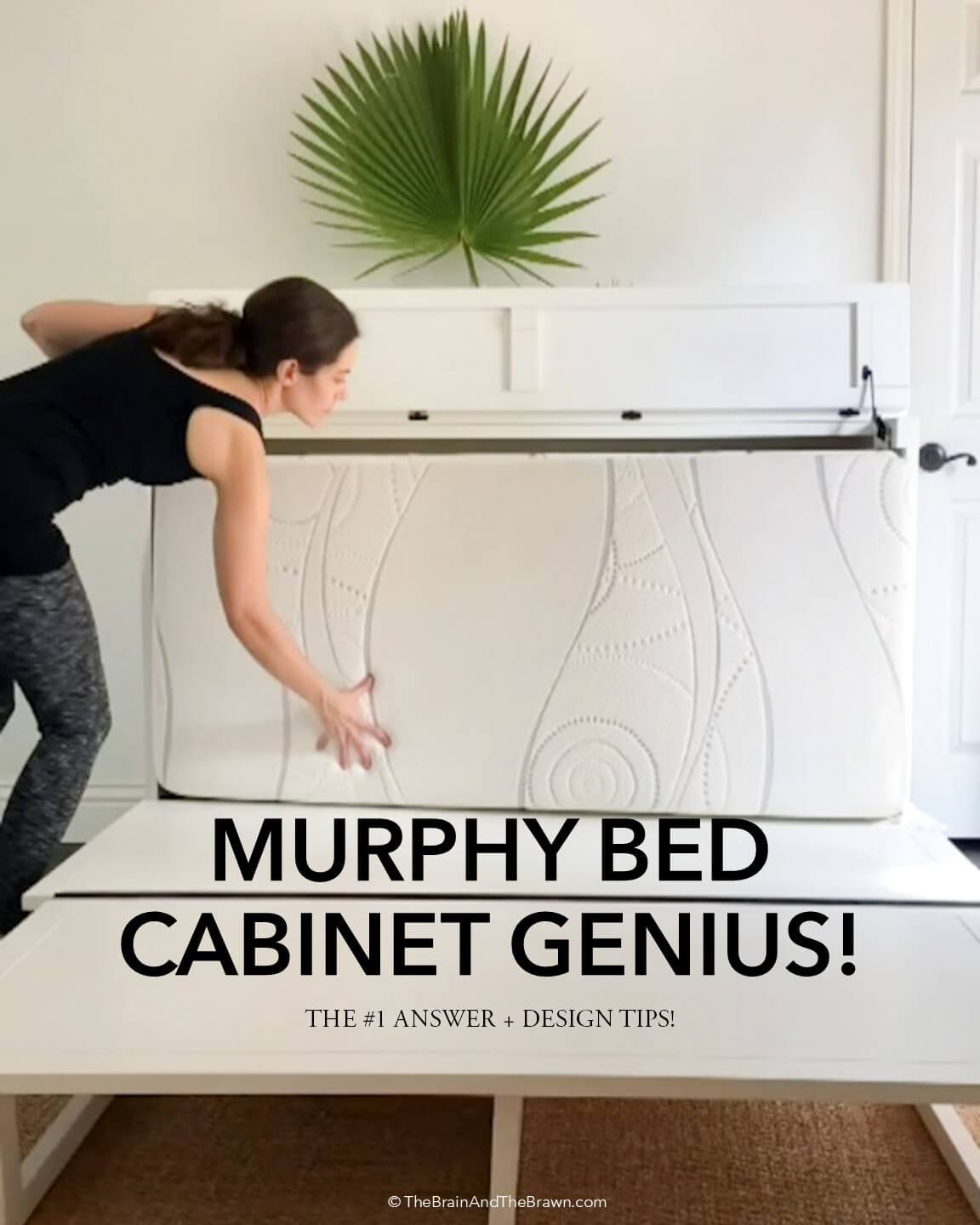 a white murphy bed cabinet being folded up when not in use, female demonstrating how to