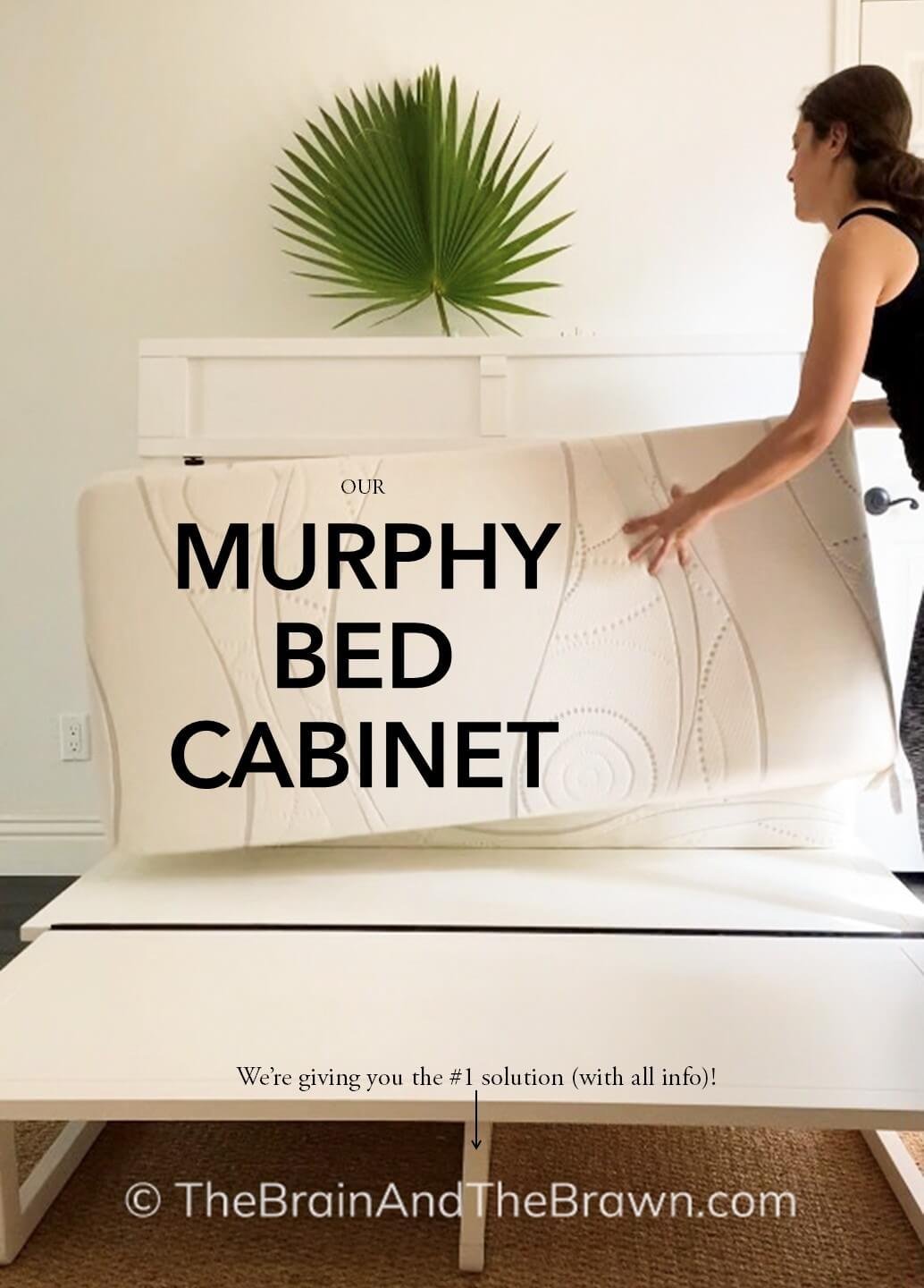a woman folding up a murphy bed cabinet in a guest room, white
