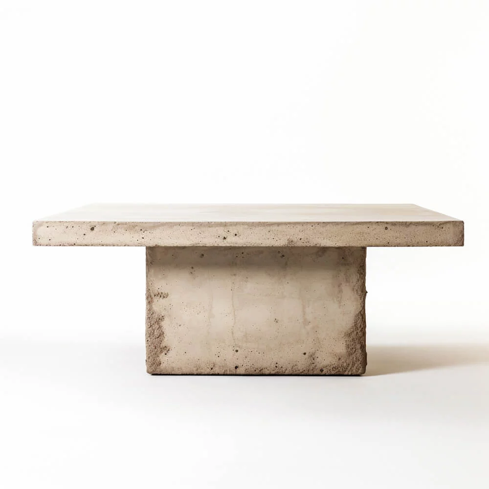 A rectangular plaster dining table design with a singular, rectangular base