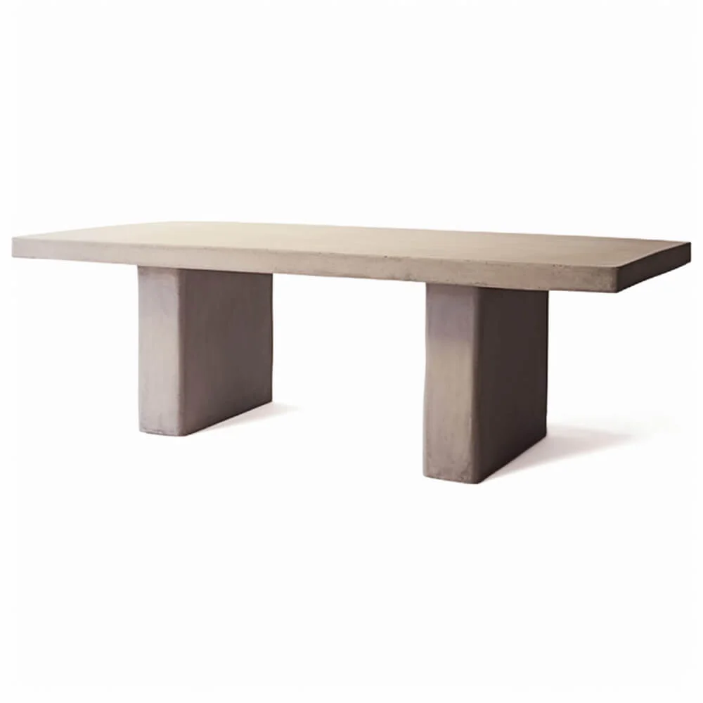 A plaster dining table with a rectangular base. 