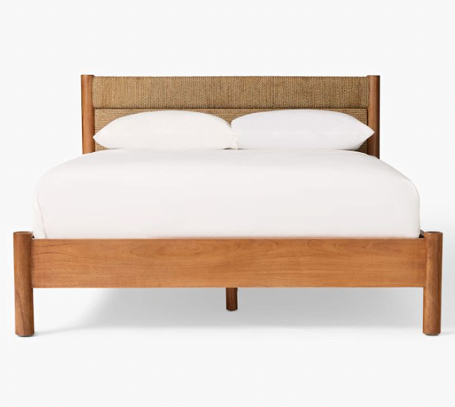 Wood and woven bedframe with headboard and white bedding