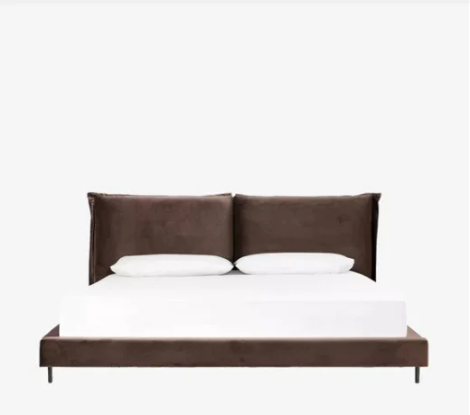 A cozy leather headboard and bedframe design with white bedding.