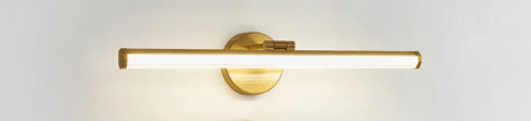 Brass bathroom lights over mirror