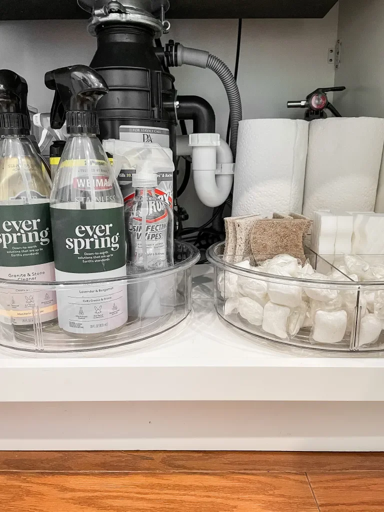 under kitchen sink storage with clear lazy susans to store supplies