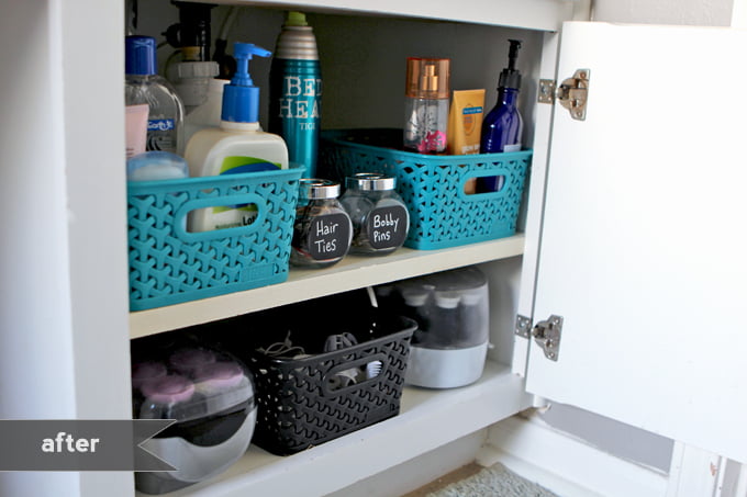 built-in under sink shelves with baskets