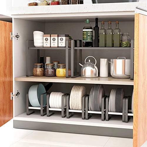 The inside of a kitchen cabinet with shelves stacked on shelves to store items.