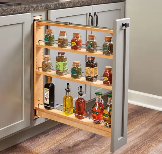 A skinny kitchen cabinet that pulls out and has narrow shelves to store spices on.