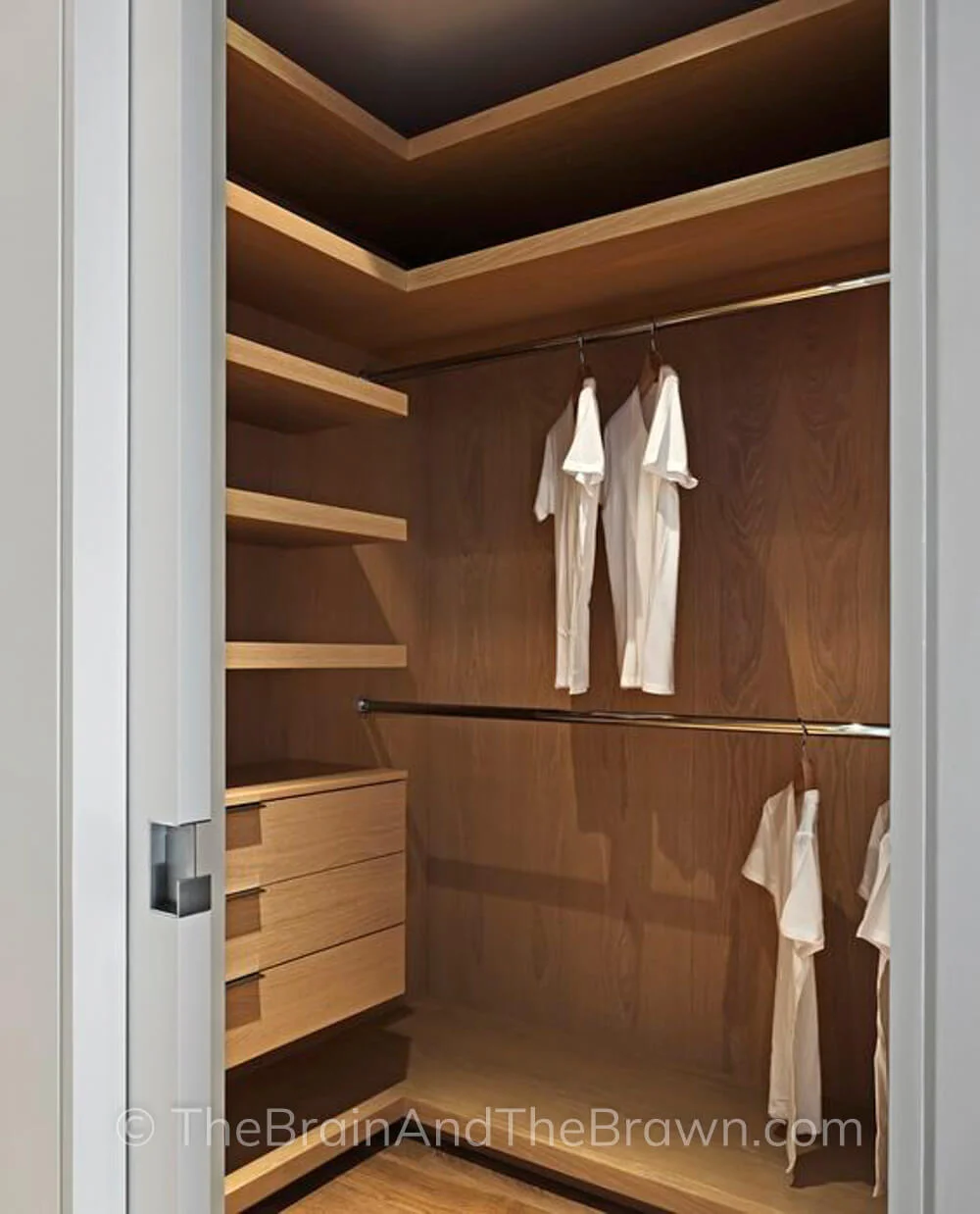 modern wood closet with shelves and hanging rods in corner